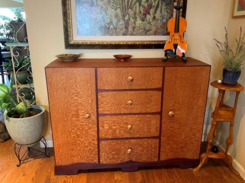 52” LCD screen cabinet (concealed lift mechanism and concealed speakers that pop out) using Australian Lacewood(English Sycamore) with Brazilian Cherry trim.